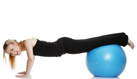 Young girl with fit ball