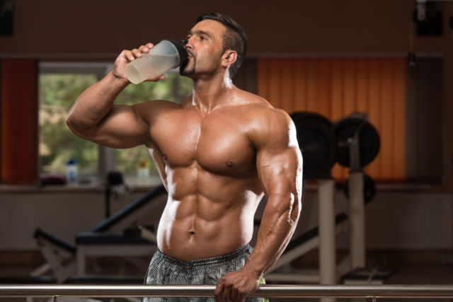 35999816 - muscular man drinking a water bottle