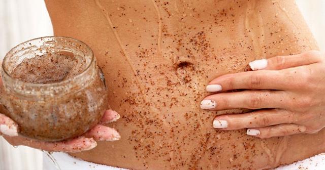 woman-applying-body-scrub